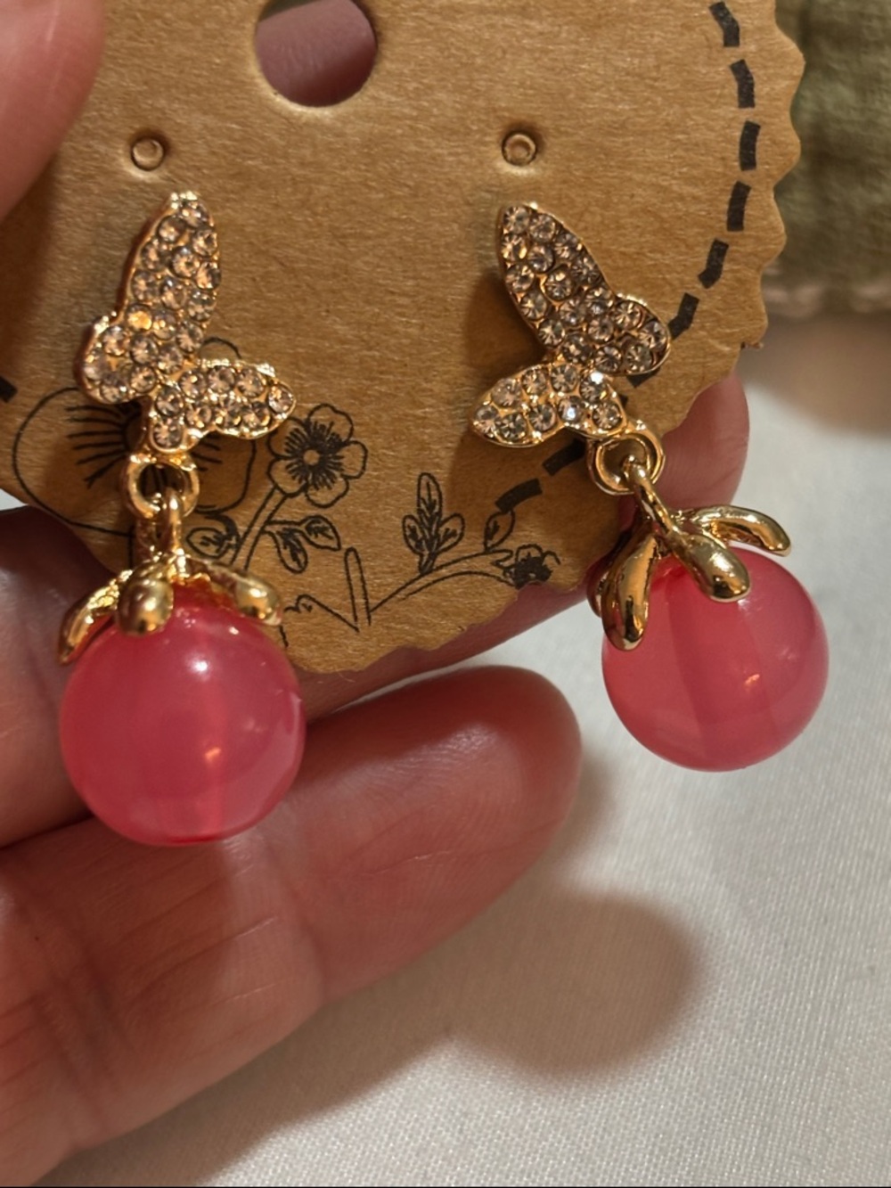 Gold Butterfly Drop Earrings with Pink Orb